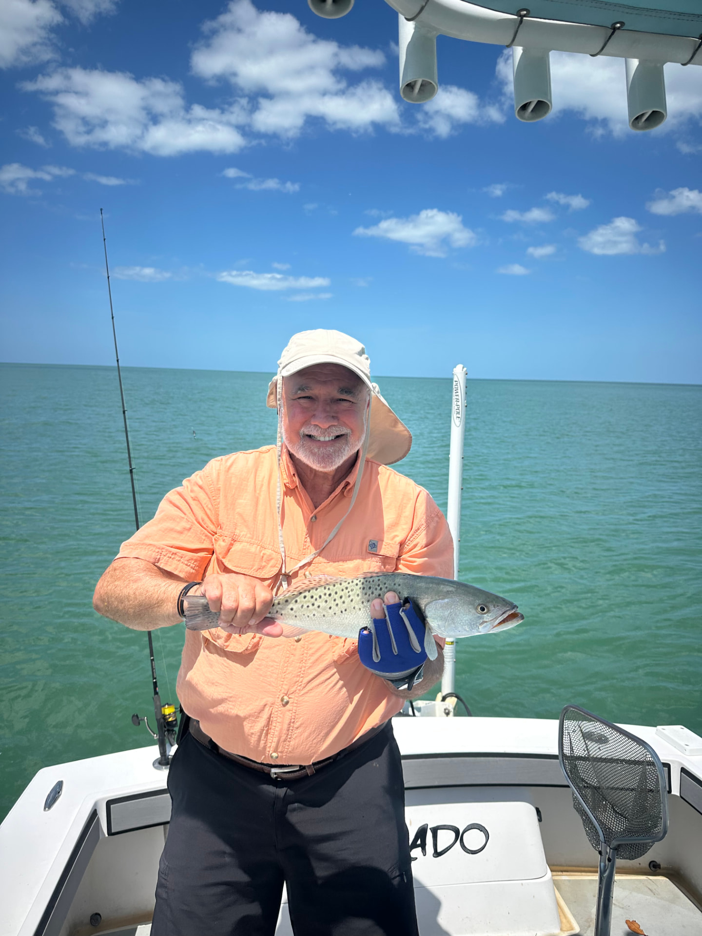 Angler with a sea trout on a Naples inshore charter