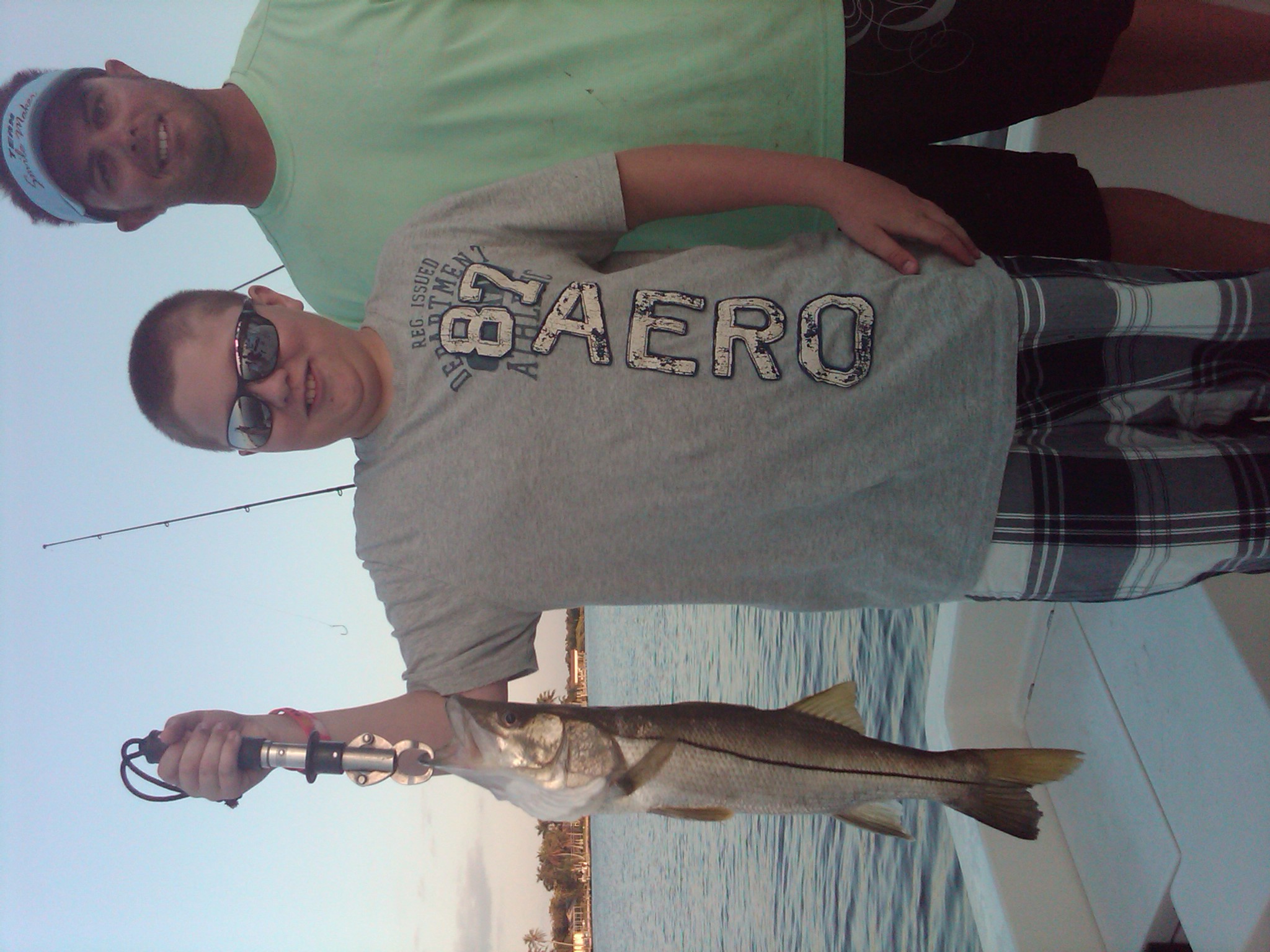 Young angler with a fresh catch in Naples